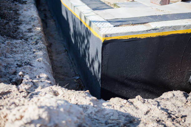 Professional Waterproofing technician working in Junction City, KY